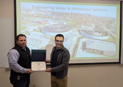 Jordan Simon, PE presented with a token of appreciation after presenting at McNeese during Engineers Week