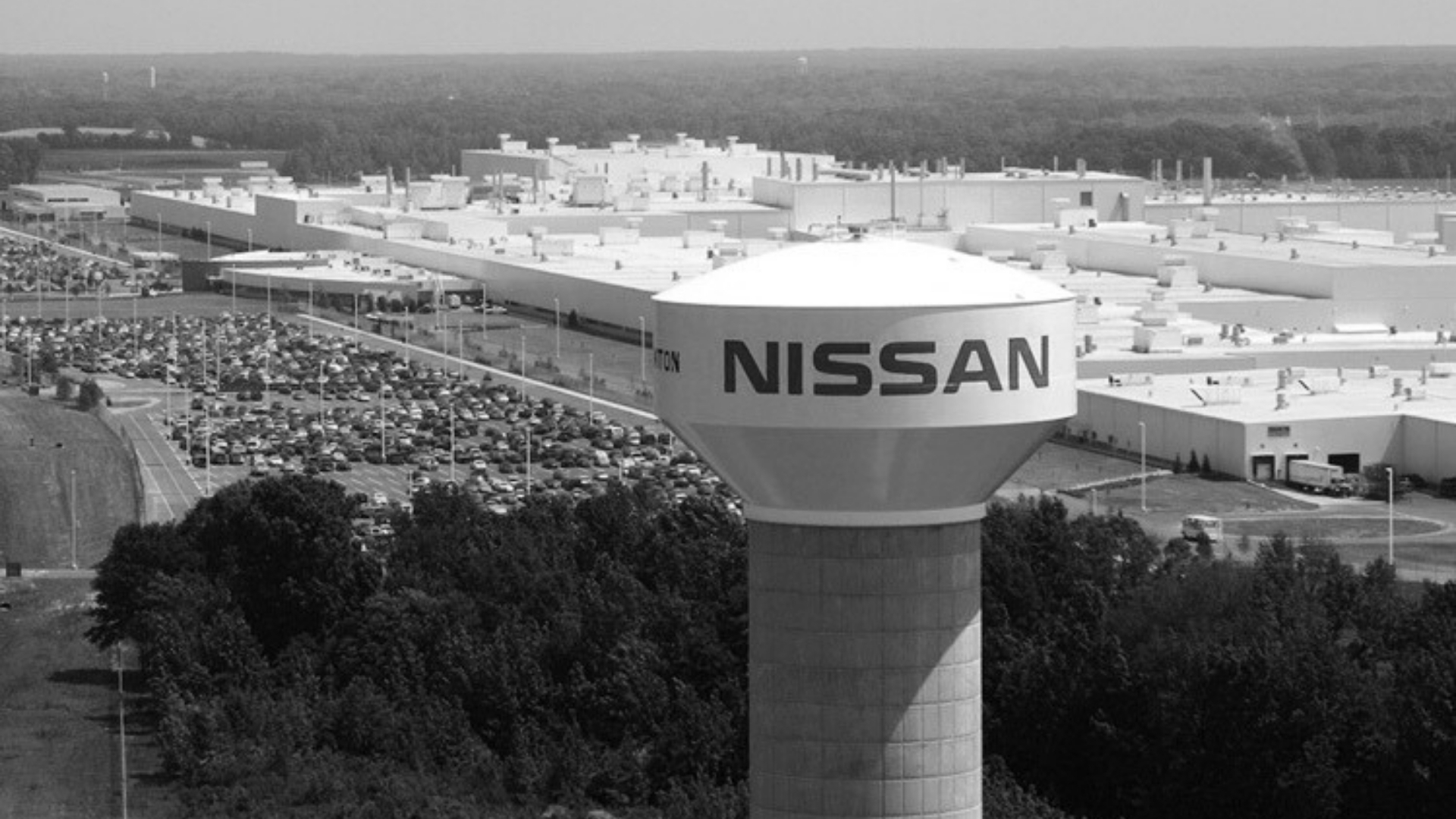 Waggoner - Nissan Vehicle Assembly Plant Aerial view of the Nissan vehicle assembly plant with a water tower and large manufacturing buildings.